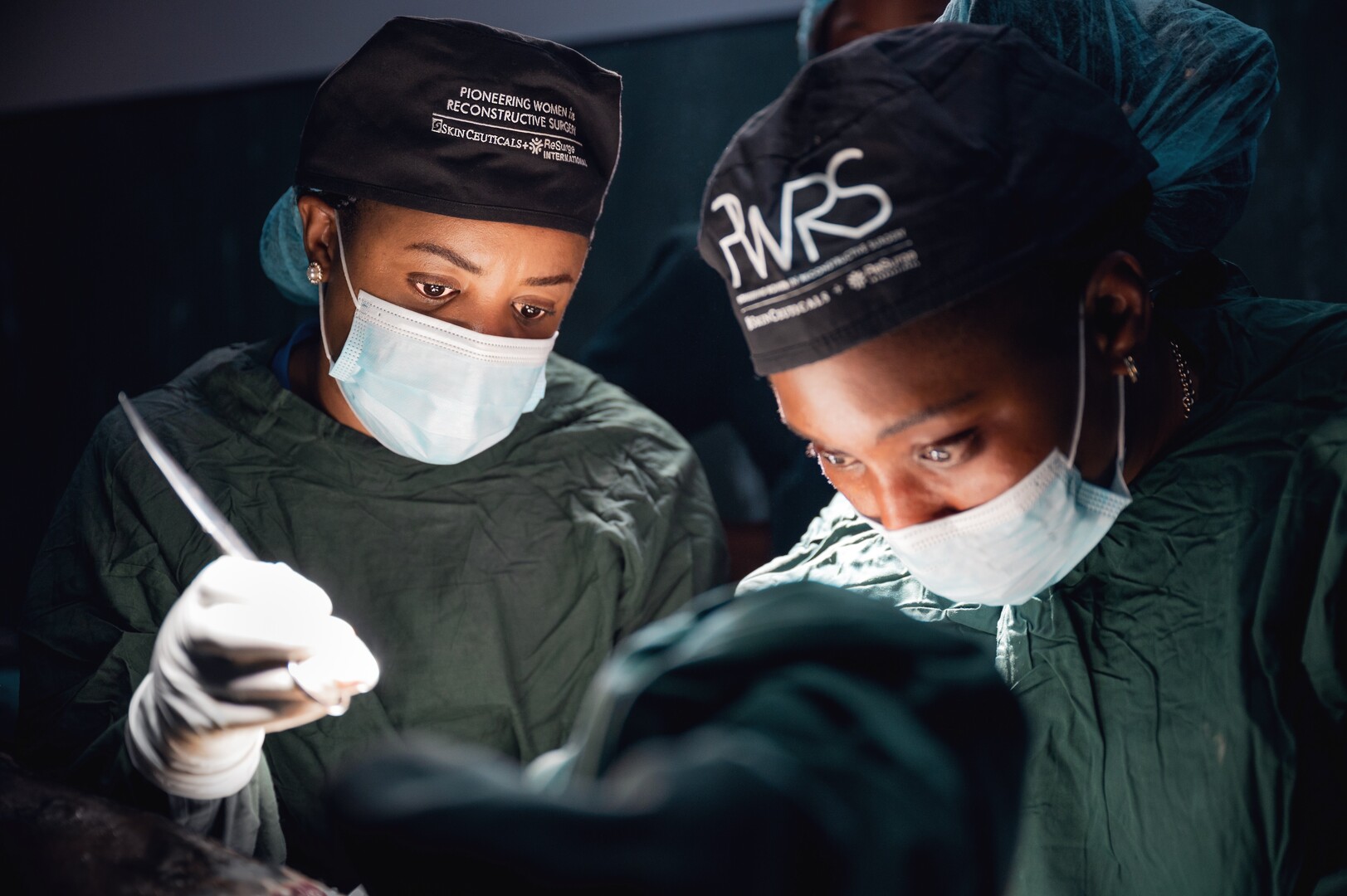 Two Black women doctors operate in a medical situtation