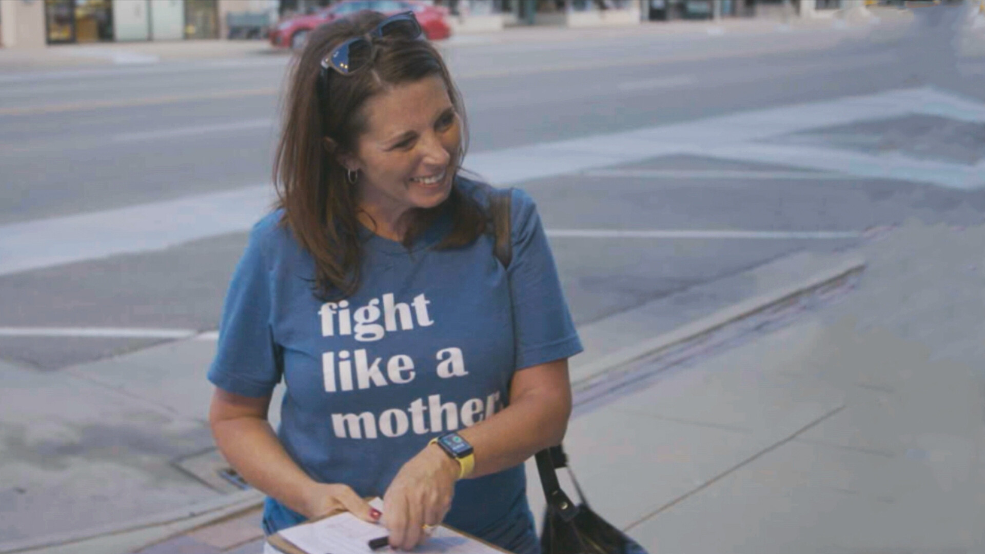 The subject's mother wears a t-shirt saying Fight Like a Mother