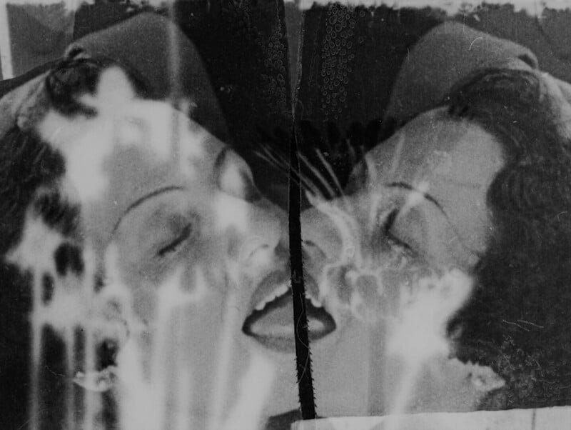 Black and white mirrored image of a woman's head