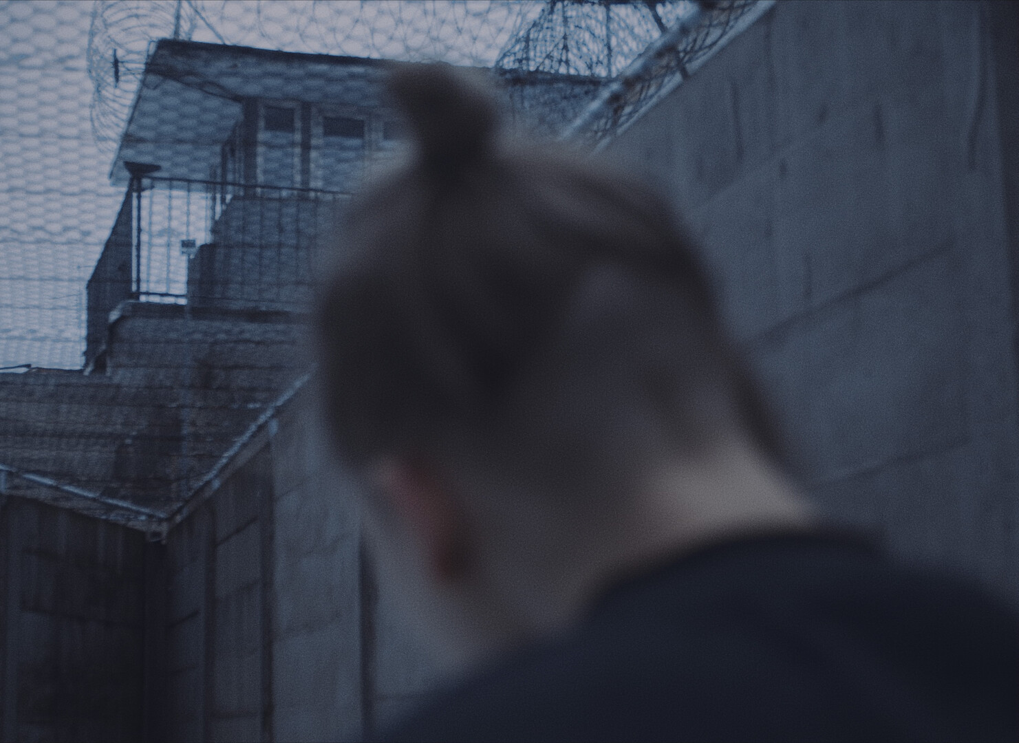 Image of main character with prison in background